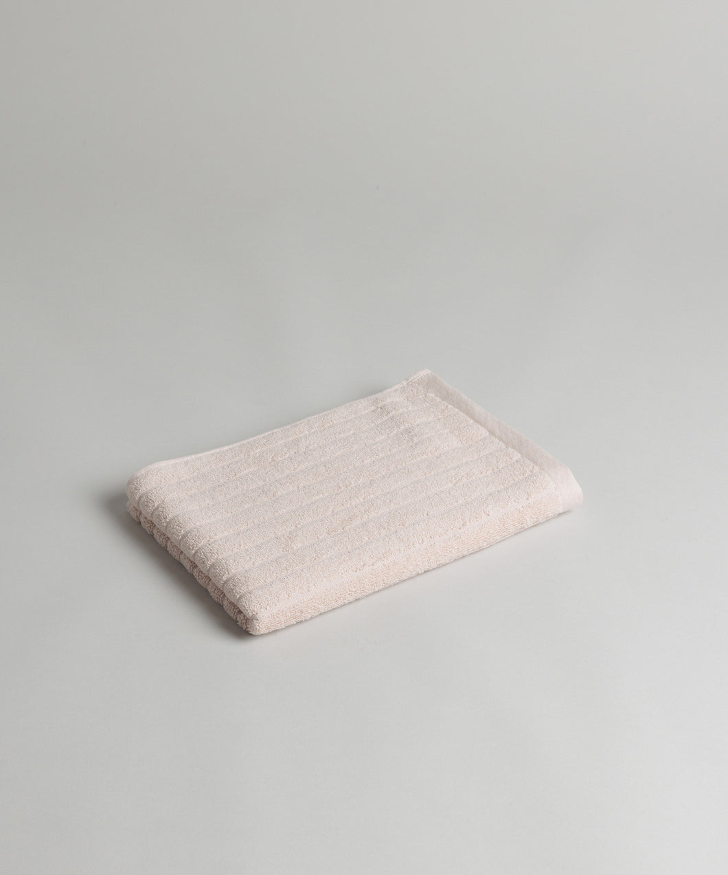 clovelly organic cotton hand towel in CLAY